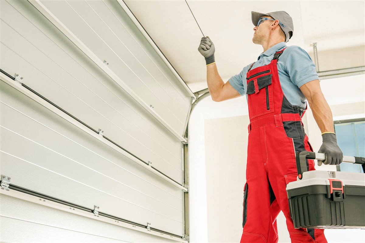 installation d'une porte de garage sectionnelle